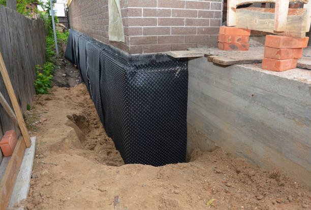 Happy homeowners after waterproofing job in Swanton